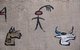 China: Dongba (Naxi) pictographic script on a house wall, Lijiang Old Town, Yunnan Province