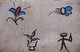 China: Dongba (Naxi) pictographic script on a house wall, Lijiang Old Town, Yunnan Province
