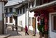 China: School children on a Lijiang Old Town back street, Yunnan Province